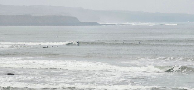 Surfer on a nice clean wave at lahinch left